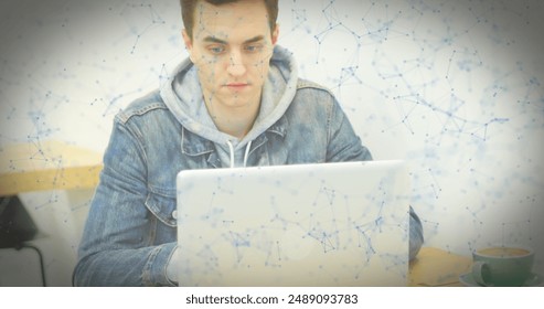 Image of qr code and shapes over caucasian man using laptop. Global business and digital interface concept, digitally generated image.