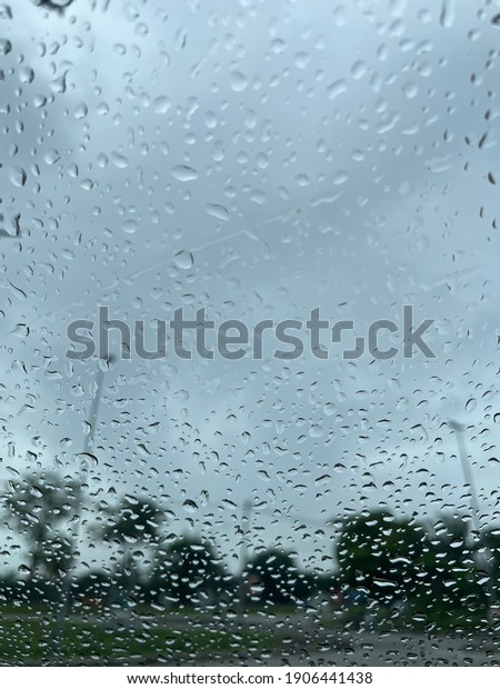 An image of raindrop from a\
car.