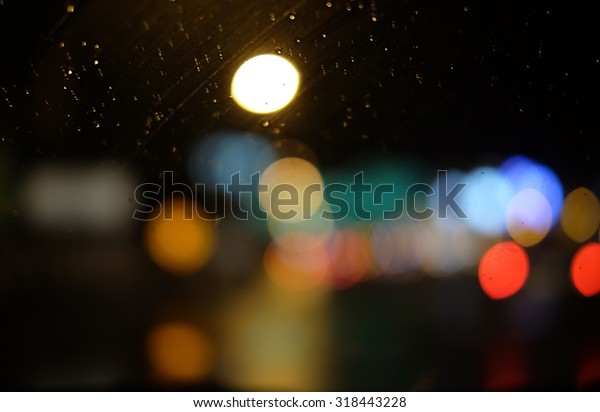 Image of\
raindrops on window at night in the city\
\
