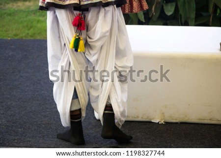 Image of a rajasthani person wearing a traditional dhoti 
