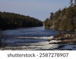 An image of rapids along the French River as seen from the south side along the Recollet Trail in French River, Ontario.