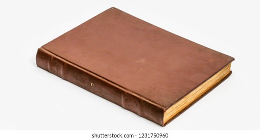 Image Of A Rare And Ancient Book, Isolated On White Background. Cover Without Text, A Generic Book.