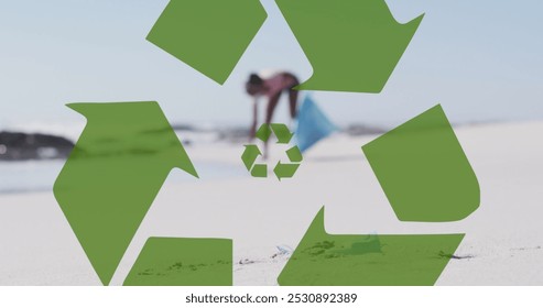 Image of recycling symbol over african american woman collecting waste on beach. Holidays, vacations and relax concept digitally generated image. - Powered by Shutterstock