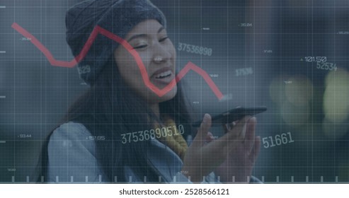 Image of red line financial data processing over asian woman on smartphone. Global computing, digital interface and data processing concept digitally generated image.