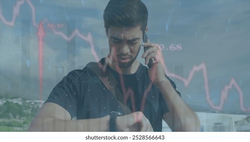 Image of red line financial data processing over biracial man on smartphone. Global computing, digital interface and data processing concept digitally generated image.