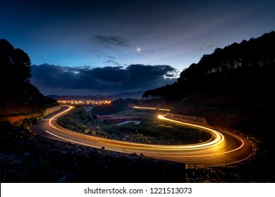 image of the road on the pass in the night, Da Lat city, Vietnam. The road is very quiet and the weather is beautiful - Powered by Shutterstock