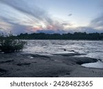 Image of rocks, river, and sunset
