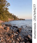 image of rocky lake shoreside in the afternoon.