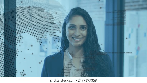 Image of rotating globe and computer language over laughing biracial woman standing in office. Digital composite, multiple exposure, globalization, coding, programming language and technology. - Powered by Shutterstock - Get 15% off with code: PIKWIZARD15