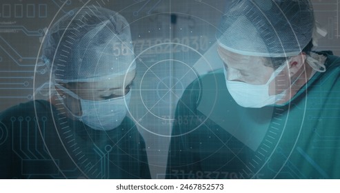 Image of round scanner against diverse male and female surgeons performing surgery at hospital. Medical healthcare technology concept - Powered by Shutterstock