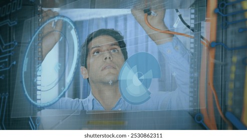Image of round scanner and data processing over caucasian male engineer working at server room. Computer interface and business data storage technology concept