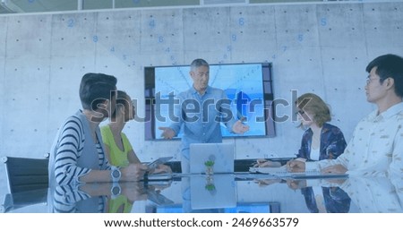 Image of rows of changing numbers over caucasian senior man giving a presentation at office. Business technology concept