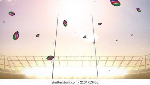 Image of rugby balls coloured with flag of namibia at stadium. sport and competition concept digitally generated image. - Powered by Shutterstock