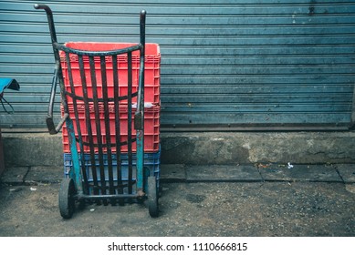 image of sack trolley(curve) parking in dirty market.
