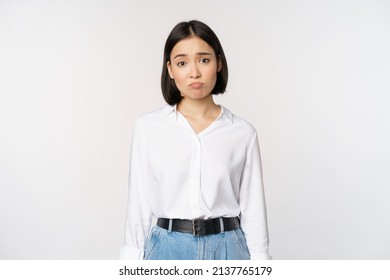 Image Of Sad Office Girl, Asian Woman Sulking And Frowning Disappointed, Standing Upset And Distressed Against White Background