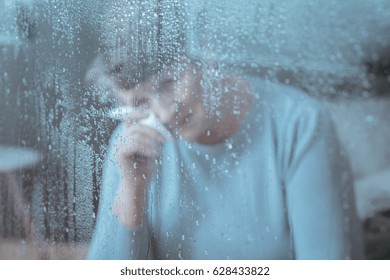 Image Of Sad, Older Woman Crying, Holding Tissue