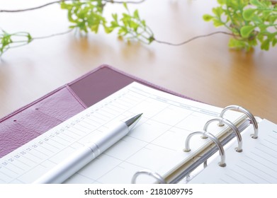 Image of schedule management of notebook and ballpoint pen