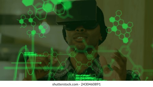 Image of scientific data in green floating in the foreground with a young mixed race man wearing a VR headset and touching interactive screen with his hands in the background 4k - Powered by Shutterstock