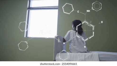 Image of scientific data processing over biracial woman in hospital bed. Global medicine, connections, computing and data processing concept digitally generated image. - Powered by Shutterstock