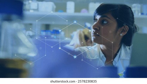 Image of scientific data processing over biracial female scientist in laboratory. Global science, connections, computing and data processing concept digitally generated image.