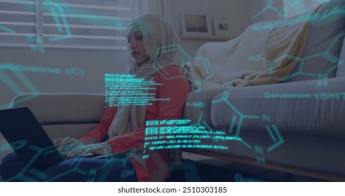Image of scientific digital data processing over biracial woman in hijab using laptop. Global science, connections, computing and data processing concept digitally generated image.
