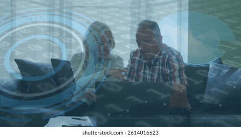 Image of scope scanning and binary coding over senior couple using laptop. global data processing and digital interface concept digitally generated image.