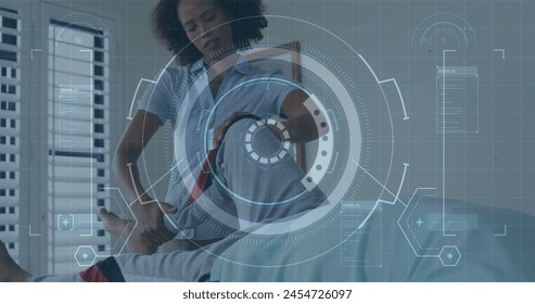 Image of scope scanning and data processing over african american nurse exercising with patient. global technology, connections and digital interface concept digitally generated image. - Powered by Shutterstock