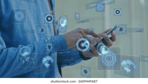 Image of scopes scanning and data processing on screens over man using smartphone. global connections, technology and digital interface concept digitally generated image.