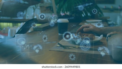 Image of scopes scanning and data processing on screens over payment with terminal. global connections, technology and digital interface concept digitally generated image.