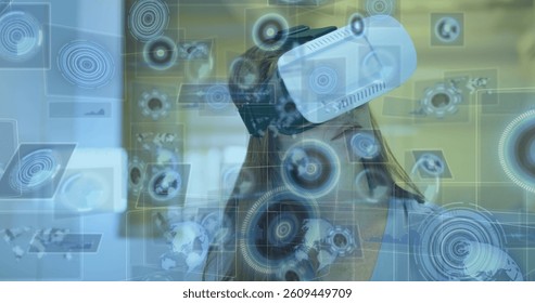Image of scopes scanning on screens over woman wearing vr headset. global data processing, communication and global technology concept digitally generated image.
