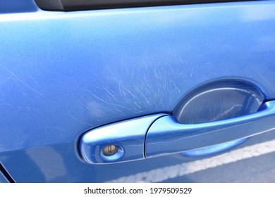 Image of Scratches around the car door handle