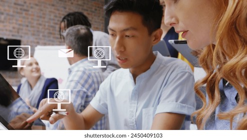 Image of screen with globe icons and data processing over diverse business people in office. Global business, finances, computing and data processing concept digitally generated image.