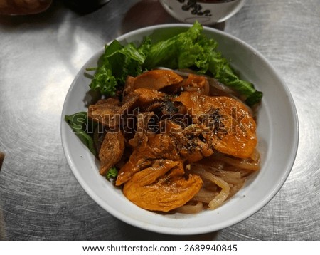 An image of a seafood dish featuring cooked tiger prawns and jumbo shrimp, served in bowls and food containers. The prawns are seasoned and presented in an appetising arrangement capturing the local 