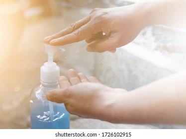 Image Selecting the focal point, a handwashing bottle, the gel is pumping alcohol into the other hand to get rid of corona virus  2019 and other germs that may touch your hand.soft background.  - Shutterstock ID 1726102915