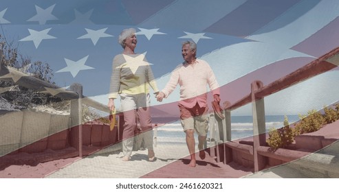 Image of senior caucasian couple holding hands on beach over flag of united states of america. american patriotism, holiday and retirement concept digitally generated image. - Powered by Shutterstock