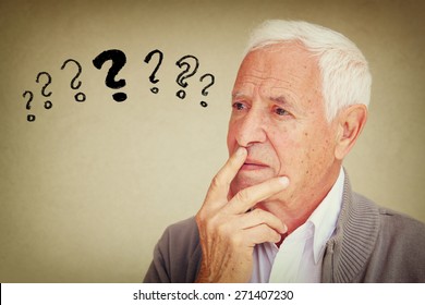 Image Of Senior Man Thinking With Set Of Question Marks Icons