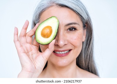 Image Of A Senior Woman Posing In Studio For A Body Positive Concepts Photoshooting. Old Model Showing Fruits And Healthy Food Good For The Skin Care Therapy