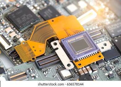 Image sensor for digital camera on electronic circuit board. - Powered by Shutterstock - Get 15% off with code: PIKWIZARD15