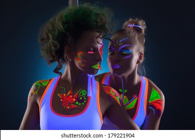 Image of sensual dancers with fluorescent makeup