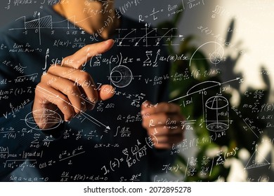 An image of a series of mathematical expressions and a hand pointing a finger at a formula. The image symbolizes the solution to the problem - Powered by Shutterstock