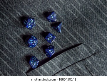 Image Of A Set Of Blue Rpg Dice On A Pinstripe Vest With A Pocket