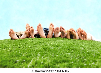 Image of several legs lying on the grass and resting