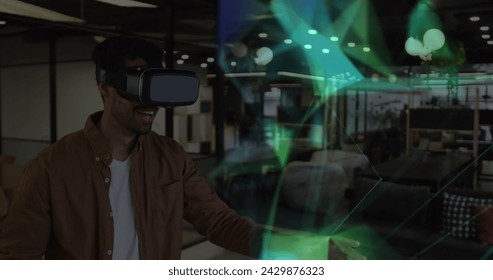 Image of shapes over mixed race businessman smiling and using vr headset. global networks, business, data processing and digital interface concept digitally generated image. - Powered by Shutterstock