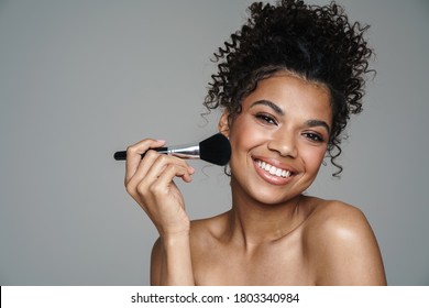 Image Of Shirtless African American Woman Using Powder Brush And Smiling Isolated Over Grey Wall