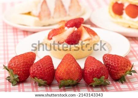 Similar – Image, Stock Photo Delicious strawberry tartlets with vanilla cream in heart shape