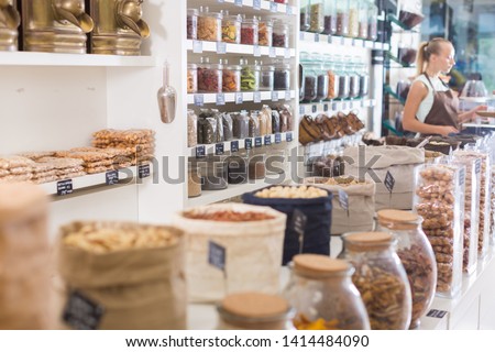 Image of showcase with dried fruits and nuts in container in the store.