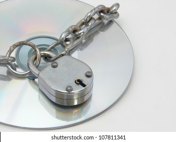 A image showing Chain,lock and CD. This can be conceptual image for software piracy & copyright.