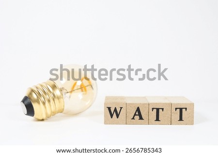An image showing power consumption using a light bulb and the word WATT.