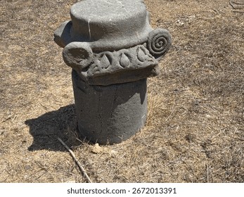 The image shows an ancient stone column capital, likely from a synagogue at en-afek naure vreserve in Northern israel