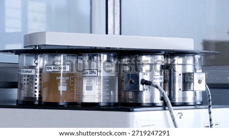 The image shows an automatic tissue processor, a laboratory instrument used in histology and pathology labs